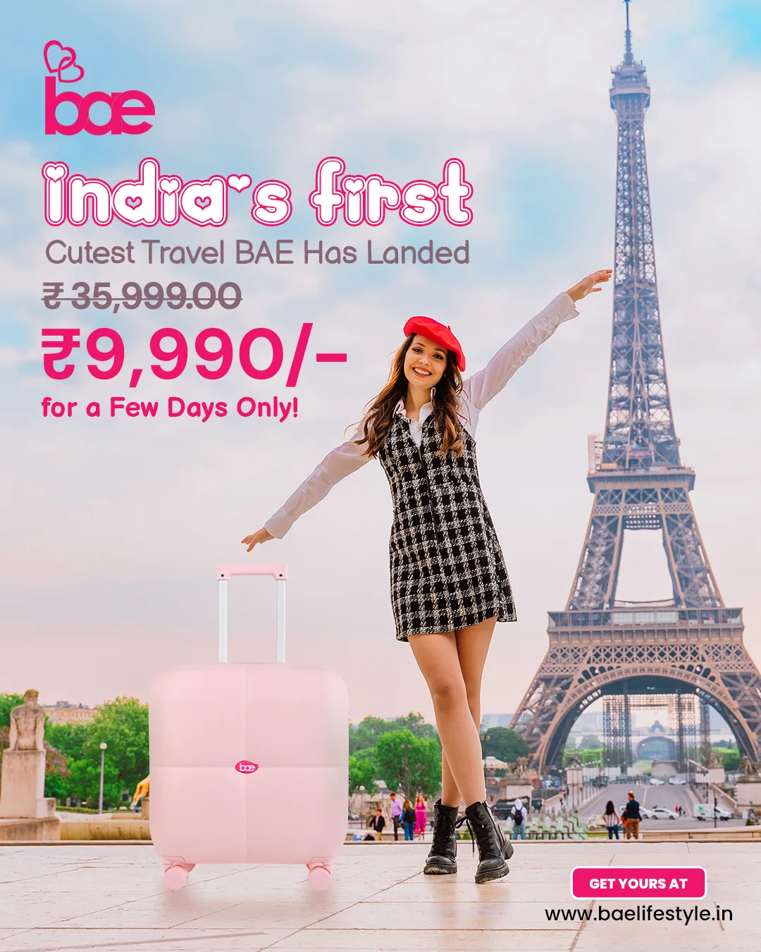 A pink suitcase at the Eiffel Tower