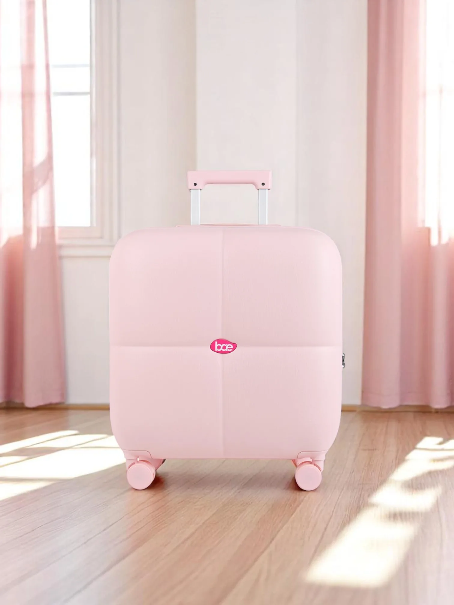 Pink cabin suitcase in a sunlit room