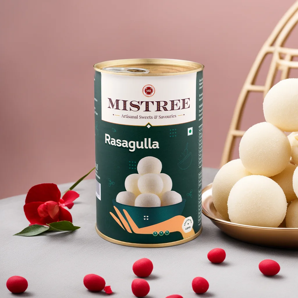 Rasagulla tin beside a bowl of rasagullas
