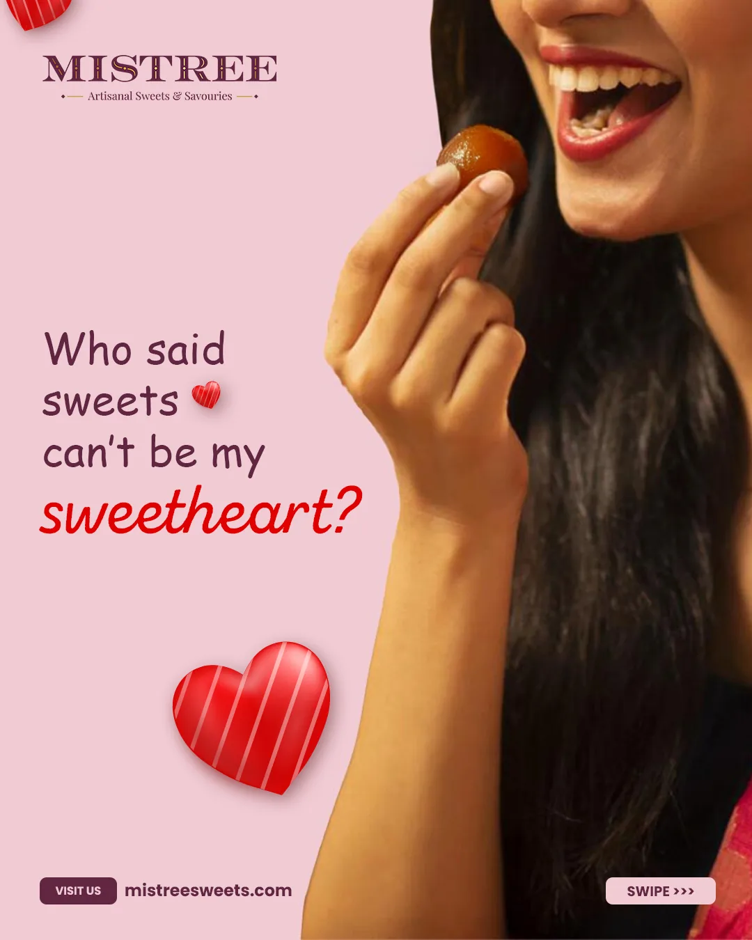 A gulab jamun held up to a smile