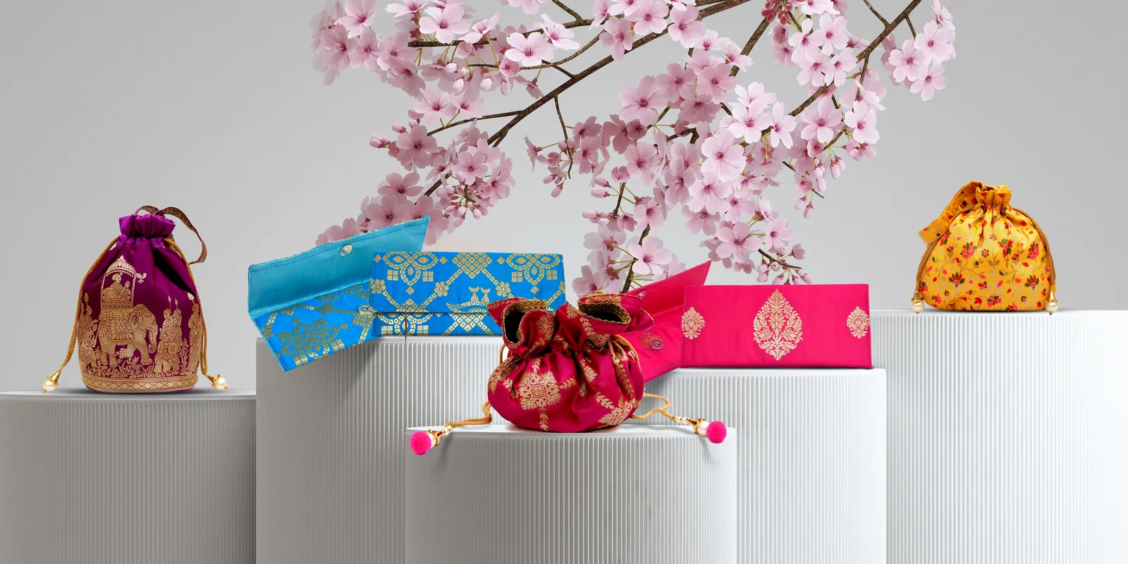 Brocade potlis under cherry blossom
